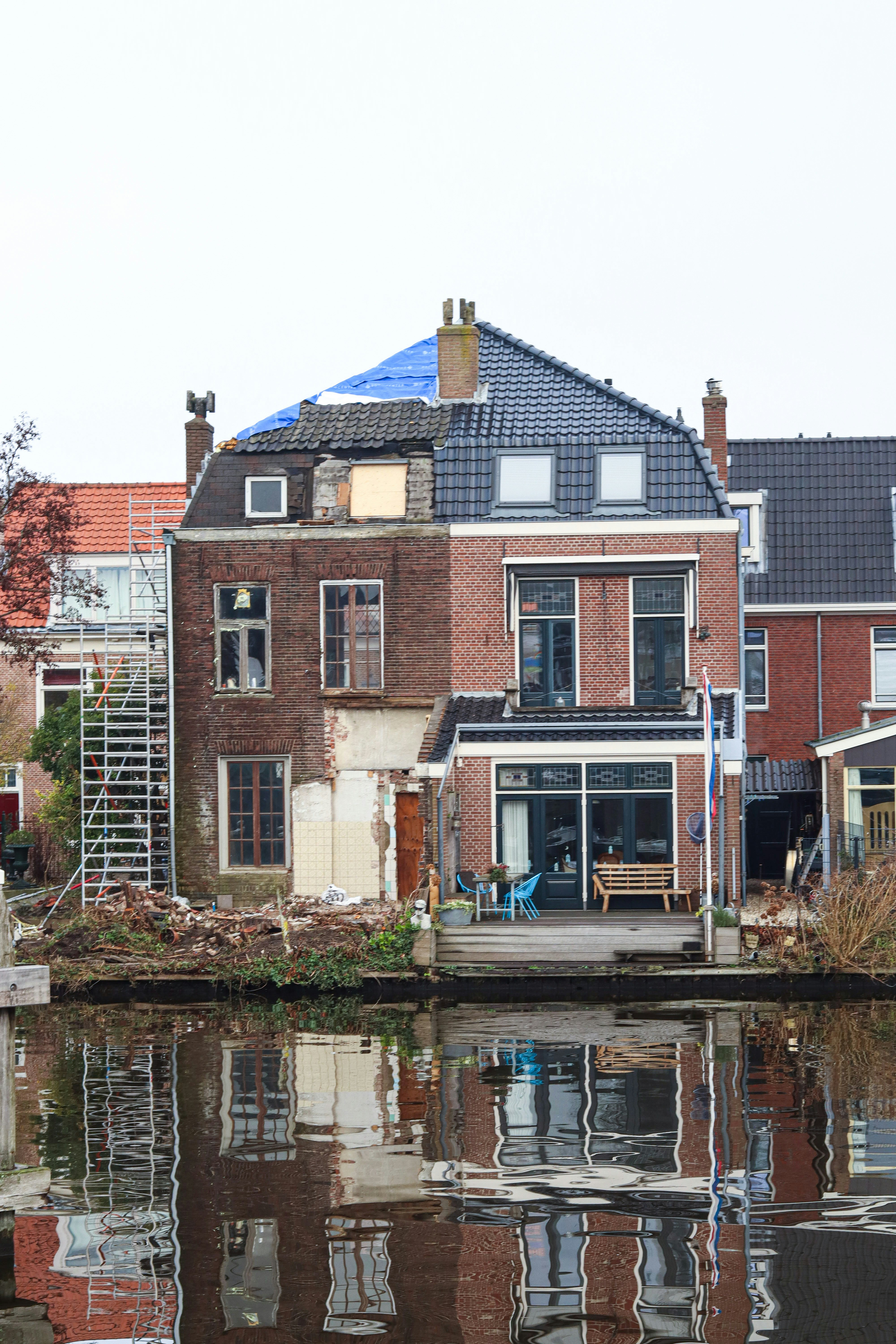 A body of water next to a row of houses